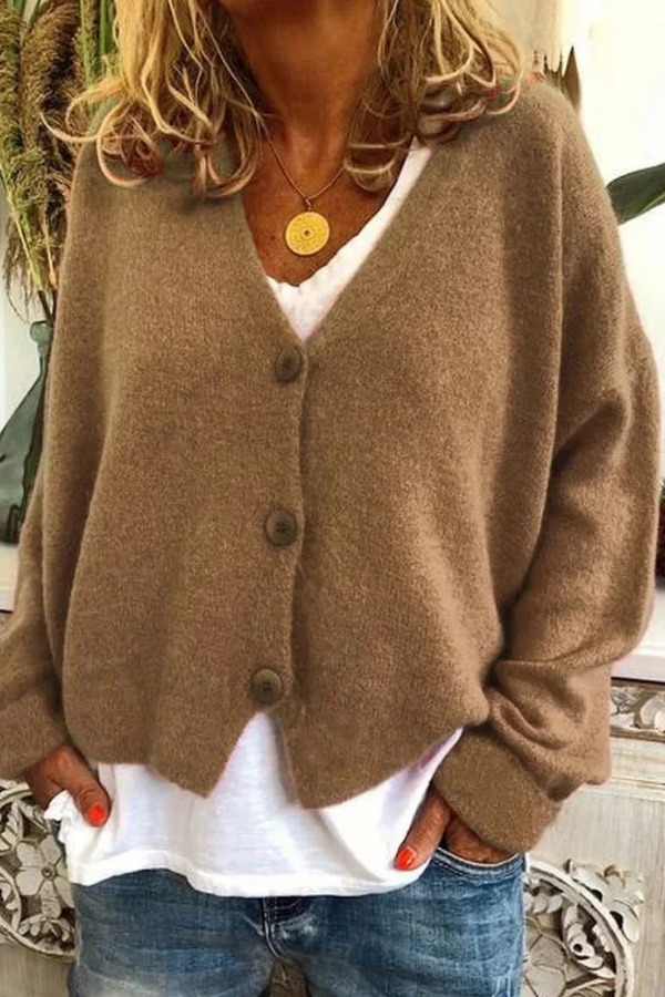 Women's cozy knit cardigan with functional buttons, perfect for a stylish layered look.