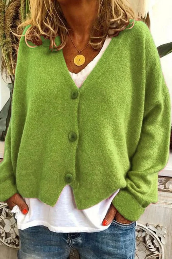 Soft knit women's button-front cardigan, great for casual outings or office comfort.