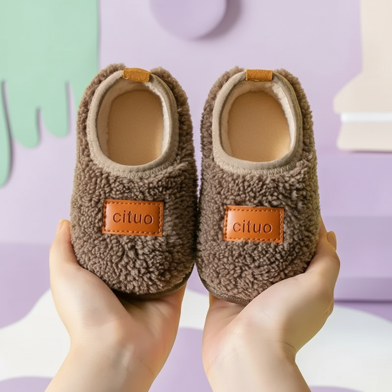 Children's winter booties with anti-slip soles, offering comfort and security.