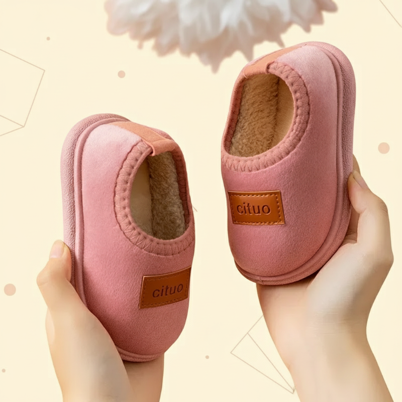 Soft suede baby winter slippers with anti-slip design, ideal for home.