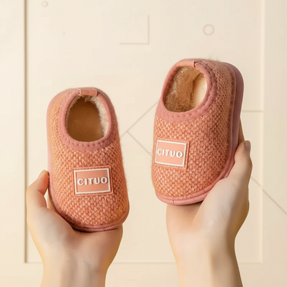 Children's winter anti-slip house slippers, providing warmth and stability indoors.