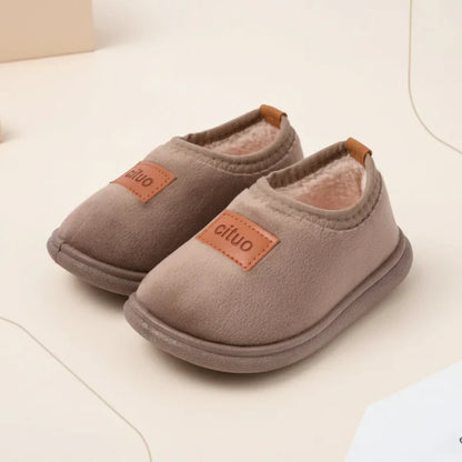 Snug baby winter slippers, suede upper and anti-slip bottom for cozy indoor play.