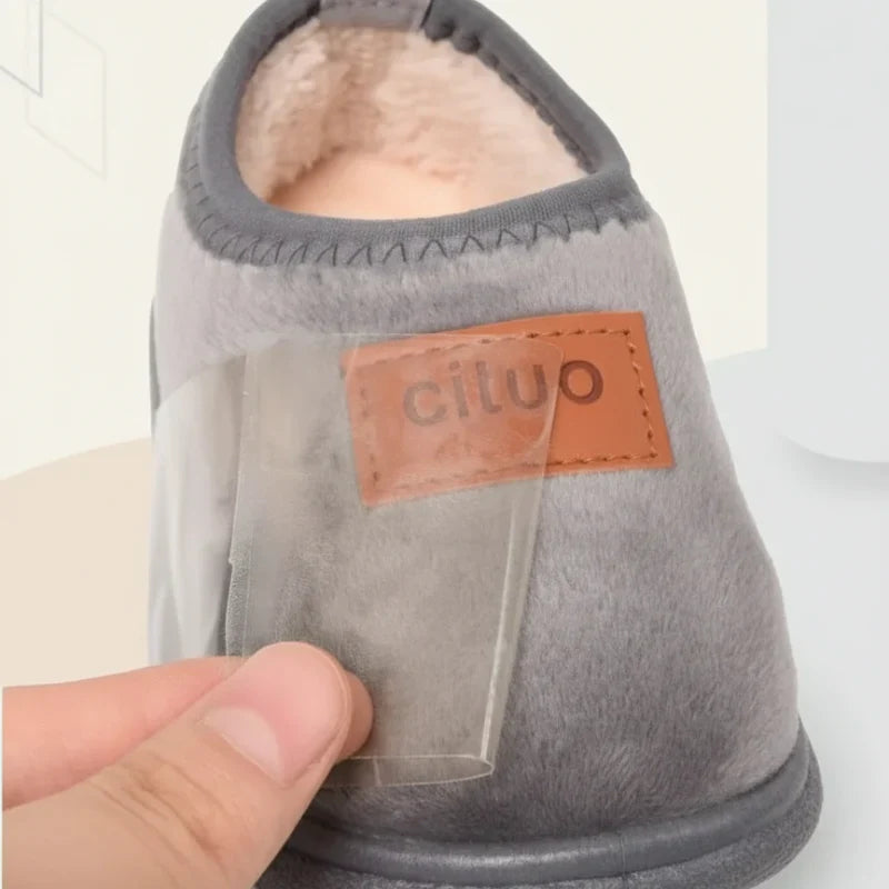 Kids' warm house slippers featuring anti-slip soles for secure winter wear.