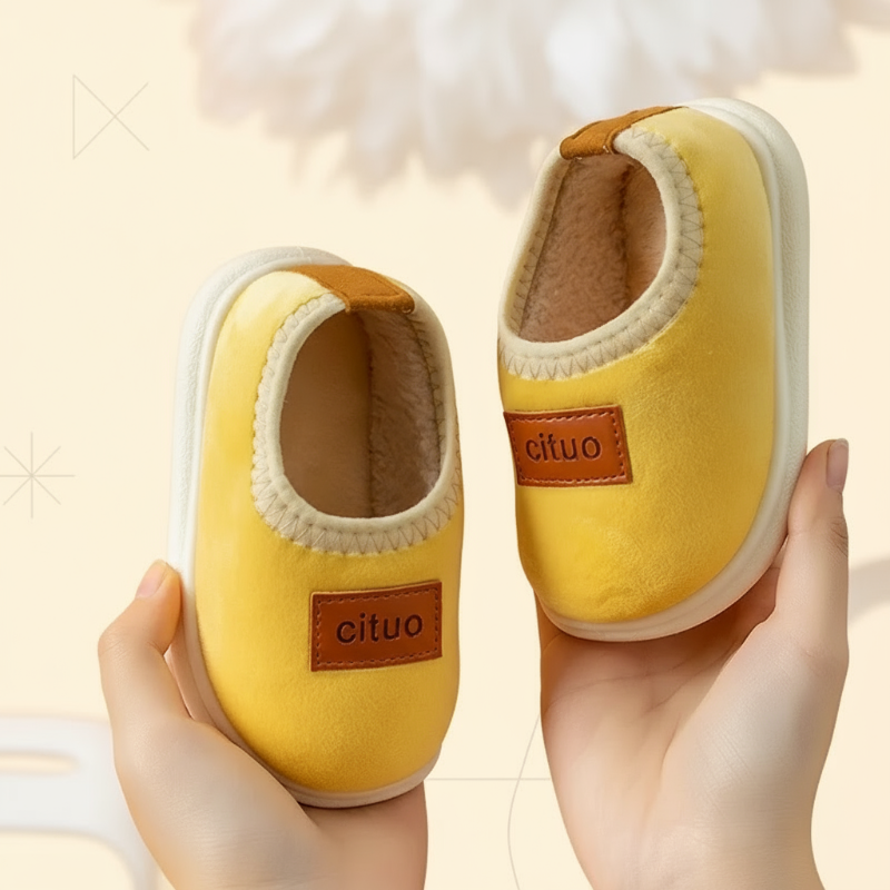 Baby and toddler anti-slip winter slippers, designed for warmth and stability.