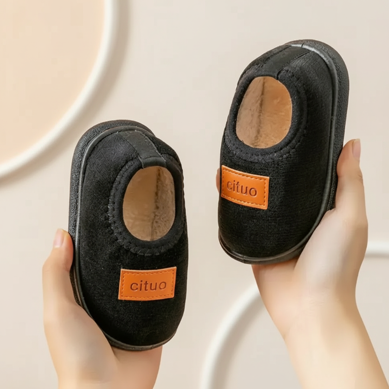 Plush cozy footwear, children's winter slippers with anti-slip rubber soles.