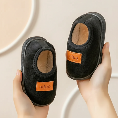 Plush cozy footwear, children's winter slippers with anti-slip rubber soles.