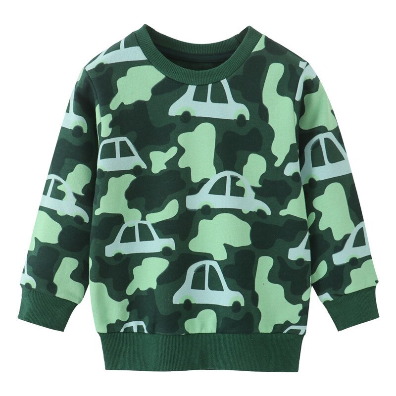 Full shot of a happy toddler boy wearing a comfortable pixel dinosaur print O-neck cotton sweater.