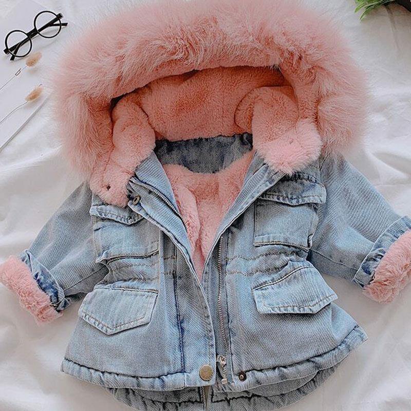 Warm kids' denim jacket with a soft faux fur hood, ideal winter coat & plush-lined outerwear.