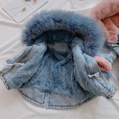 Stylish toddler denim jacket featuring a cozy faux fur hood & warm plush lining for winter.