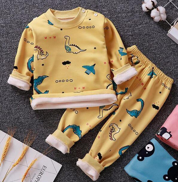 Cozy flannel kids pajamas set with smiling moon and star print for warm winter sleep