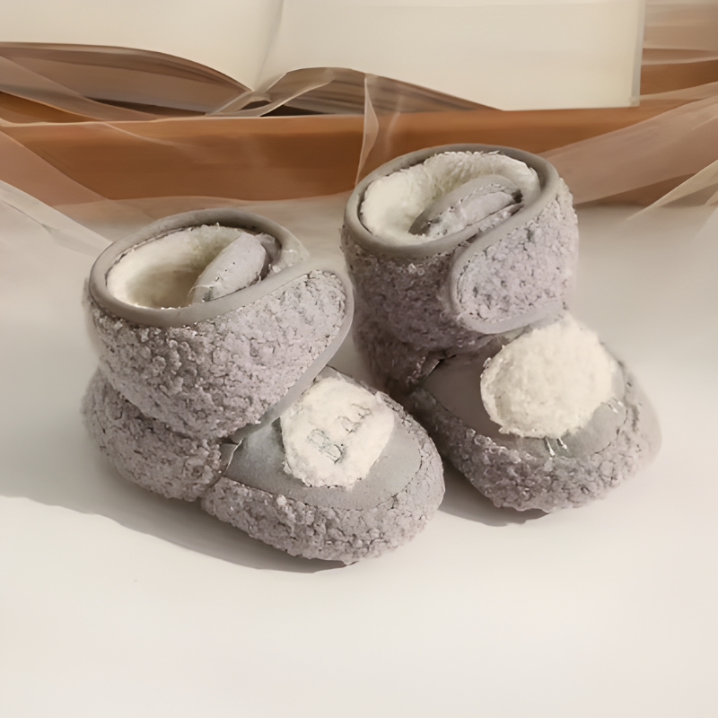 Soft sole fleece crib shoes for infants, ideal for cozy wear and early walking, baby footwear.