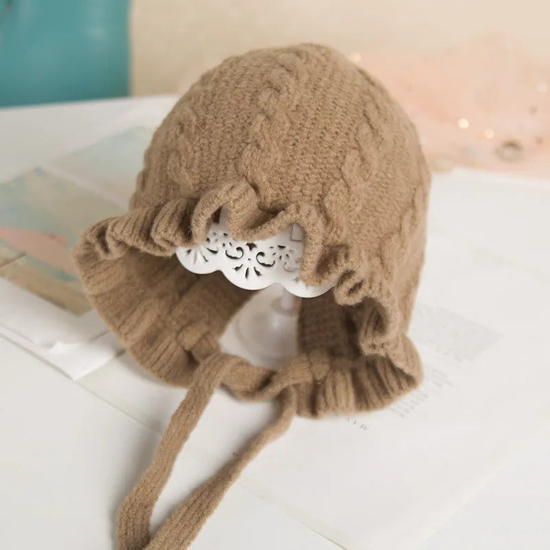 Newborn girl's hooded woolen hat, gentle on skin, stylish & practical for winter