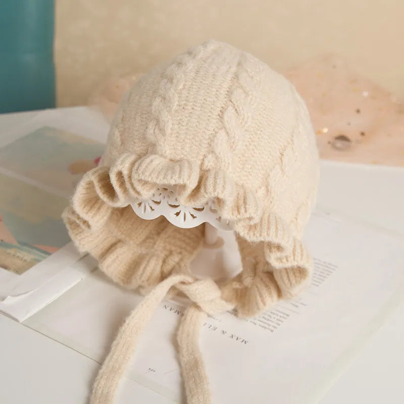 Infant girl's pink hooded hat, warm cotton, essential for baby winter accessories