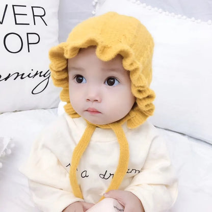 Baby girl's hooded hat with pom-pom detail, soft pink wool, perfect winter warmth