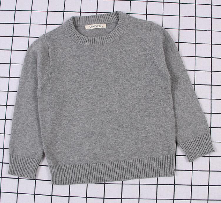 Warm red cable knit pullover sweater for children, perfect for festive occasions or daily wear.