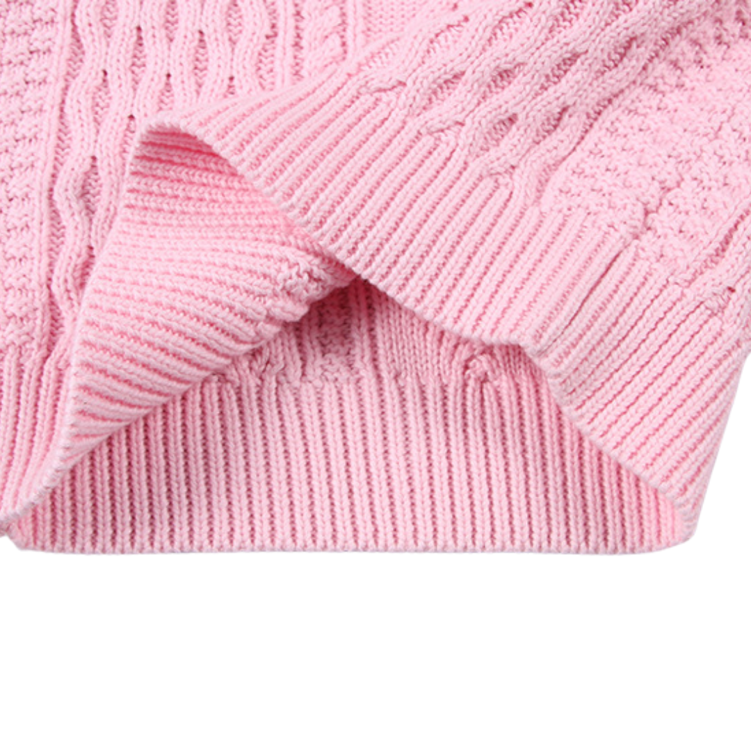 Light-colored kids cable knit pullover sweater, versatile and cozy for everyday wear in chilly seasons.