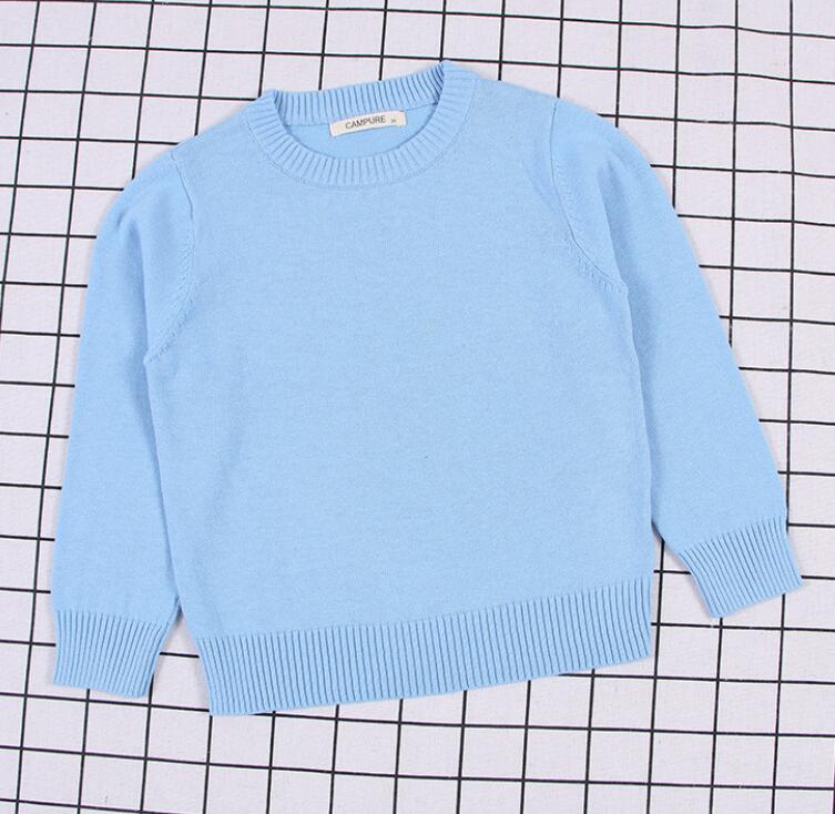 Green cable knit pullover sweater, robust and stylish for active children's winter fashion.