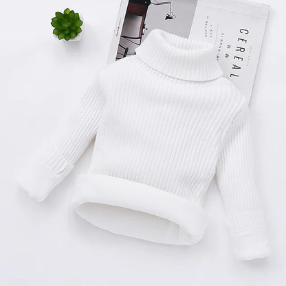 Adorable kids' winter sweater: a padded turtleneck in a durable cotton blend, perfect for play.