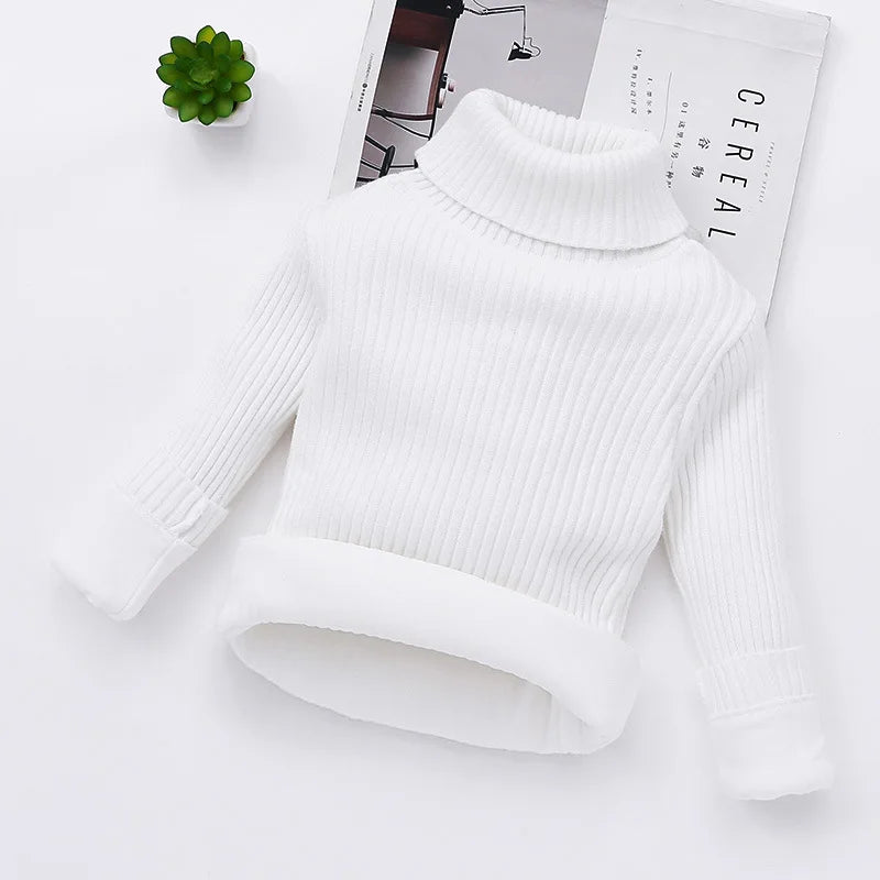 Toddler wearing a padded turtleneck sweater, demonstrating the snug fit and winter comfort.