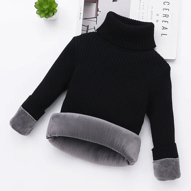 Detail of the padded texture on a kids' turtleneck sweater, essential for cold weather wear.