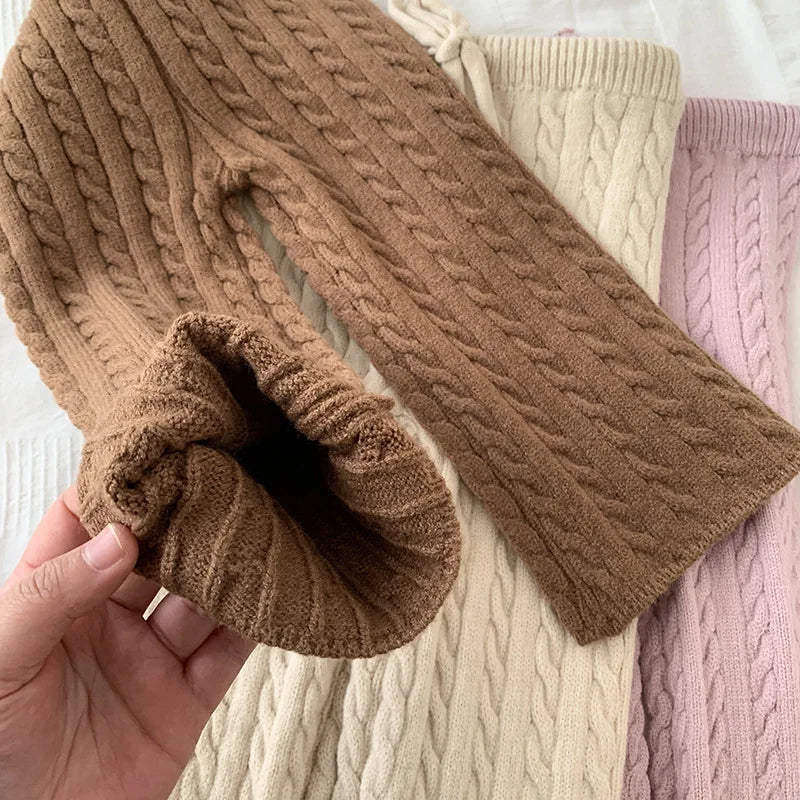 Adorable girls' two-piece knitted set, sweater and matching pants, kids winter fashion.