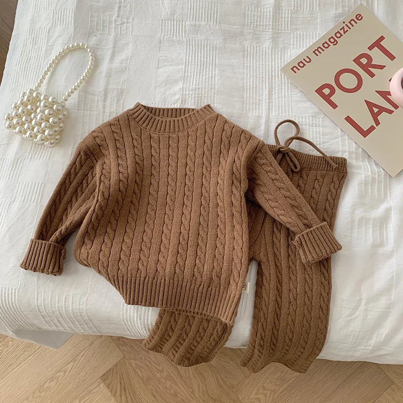 Girls' warm knitted sweater and thermal pants set, essential for fall and winter fashion.