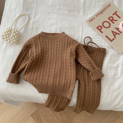 Girls' warm knitted sweater and thermal pants set, essential for fall and winter fashion.