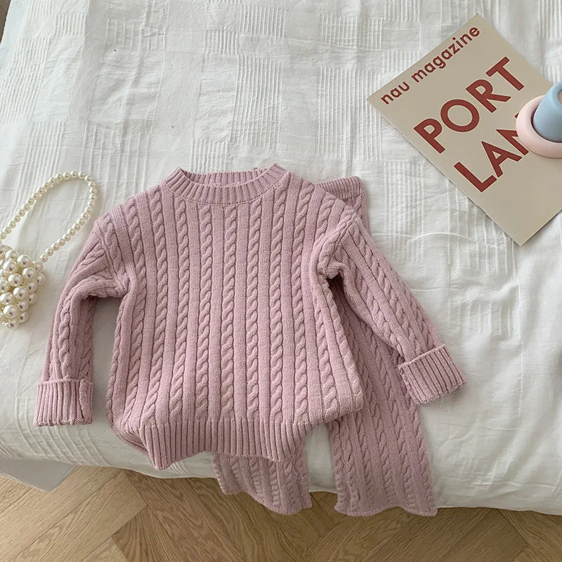 Full view of a girls' cozy knitted sweater and pants set, perfect for cold weather apparel.