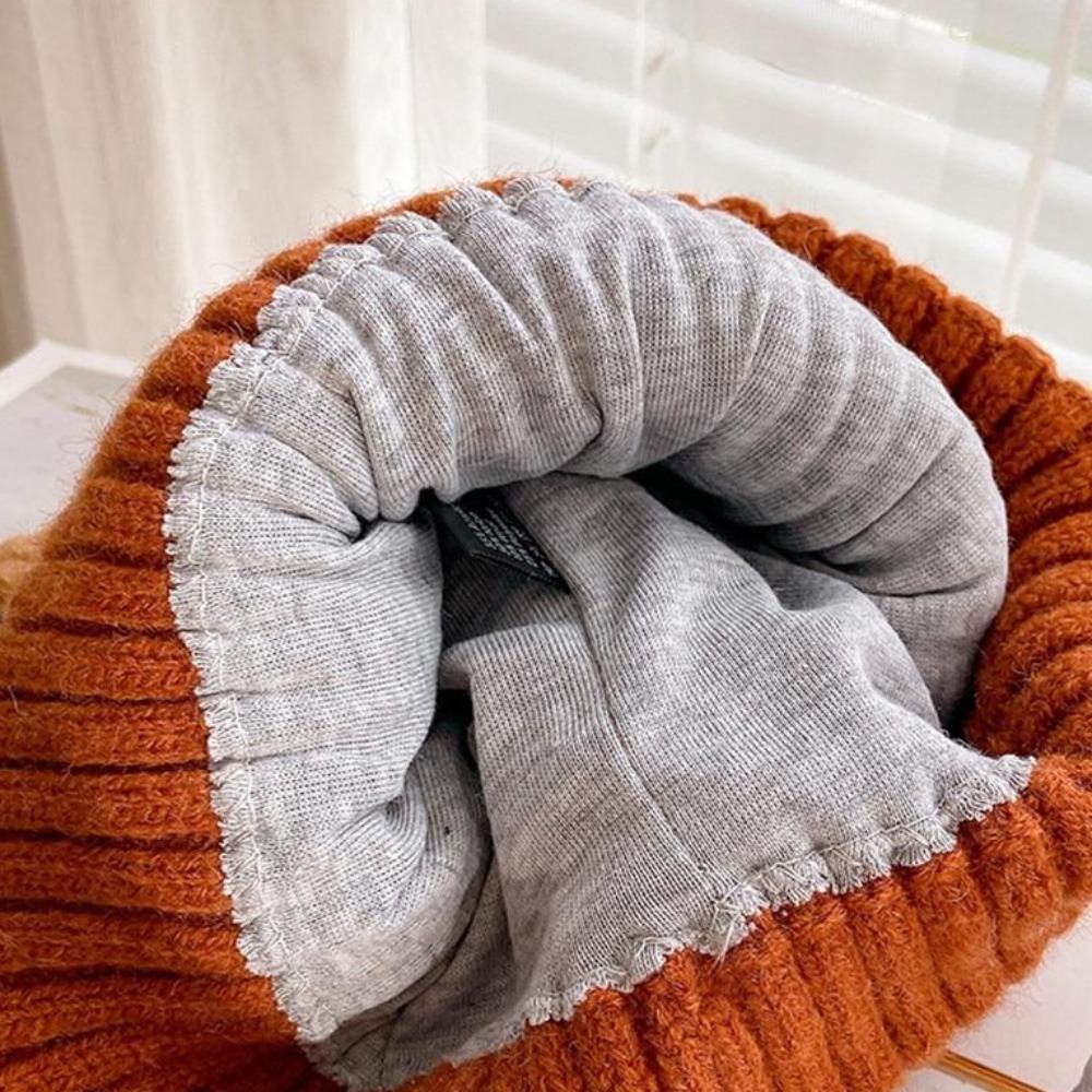 Premium knitted women's winter hat with cute cat ears, offering warmth & trendy cold weather style.