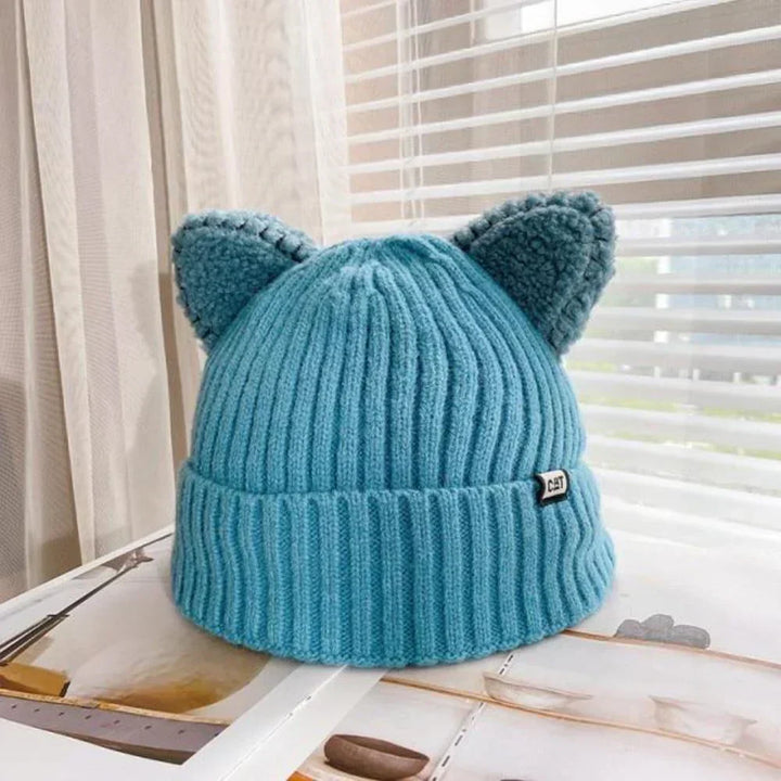 Cute cat ear knitted winter hat for women, a cozy and fashionable accessory for cold days.