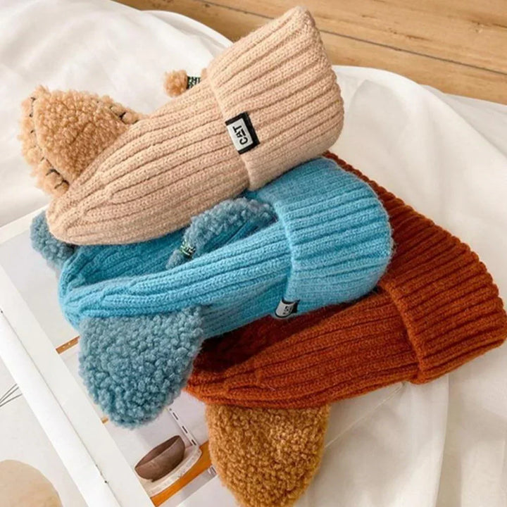 Adorable women's winter hat with cat ears, finely knitted for a cozy feel and fashionable look.