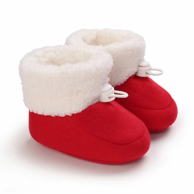 Soft cotton baby boots, perfect for keeping small feet toasty during winter.