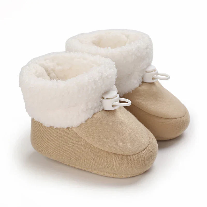 Infant cotton boots with non-slip sole, ensuring warmth and safety for little feet.