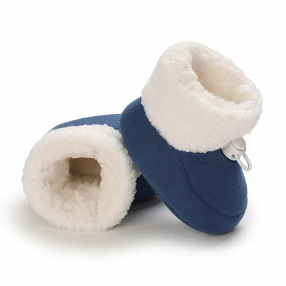 Close-up of a warm baby boot, showing soft material and sturdy non-slip sole.