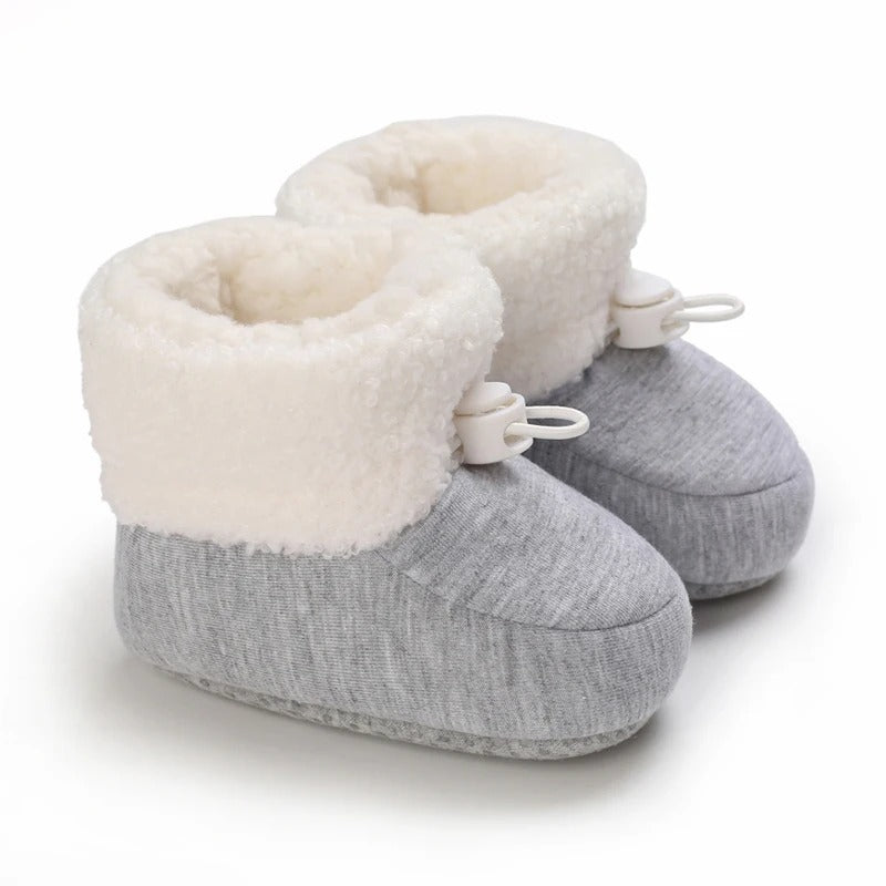 Pair of colorful baby winter boots, featuring non-slip grip for active infants.