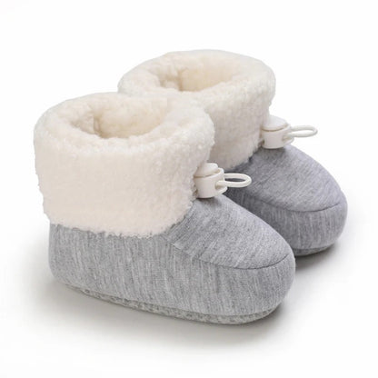 Pair of colorful baby winter boots, featuring non-slip grip for active infants.