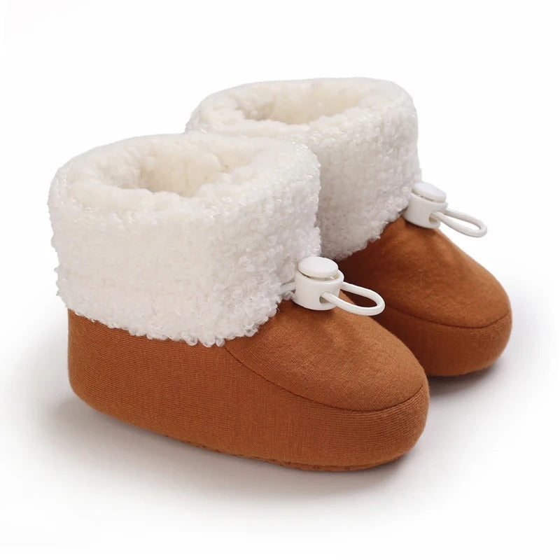 Comfortable winter shoes for toddlers, offering warmth and protection in cold conditions.