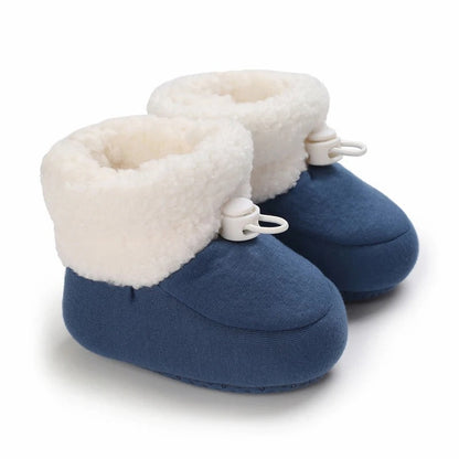 High-top baby boots with adjustable closure, providing a secure and warm fit.