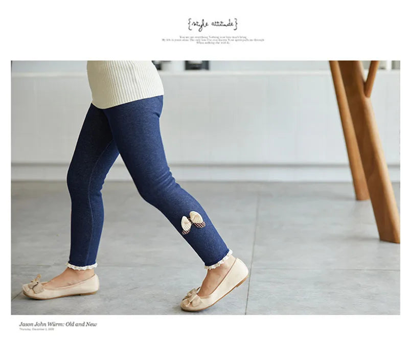 Warm winter leggings for girls, featuring an elegant bow design at the bottom
