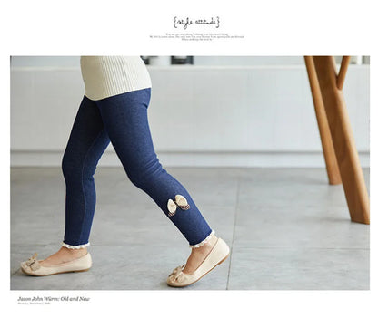 Warm winter leggings for girls, featuring an elegant bow design at the bottom
