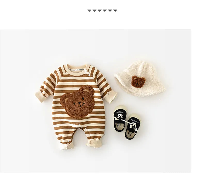 Toddler playing in a thick-lined striped bear romper, cozy and flexible