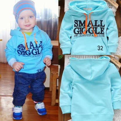 Cozy toddler unisex hooded sweatshirt, perfect for fall. Soft fleece-lined cotton blend for everyday warmth.
