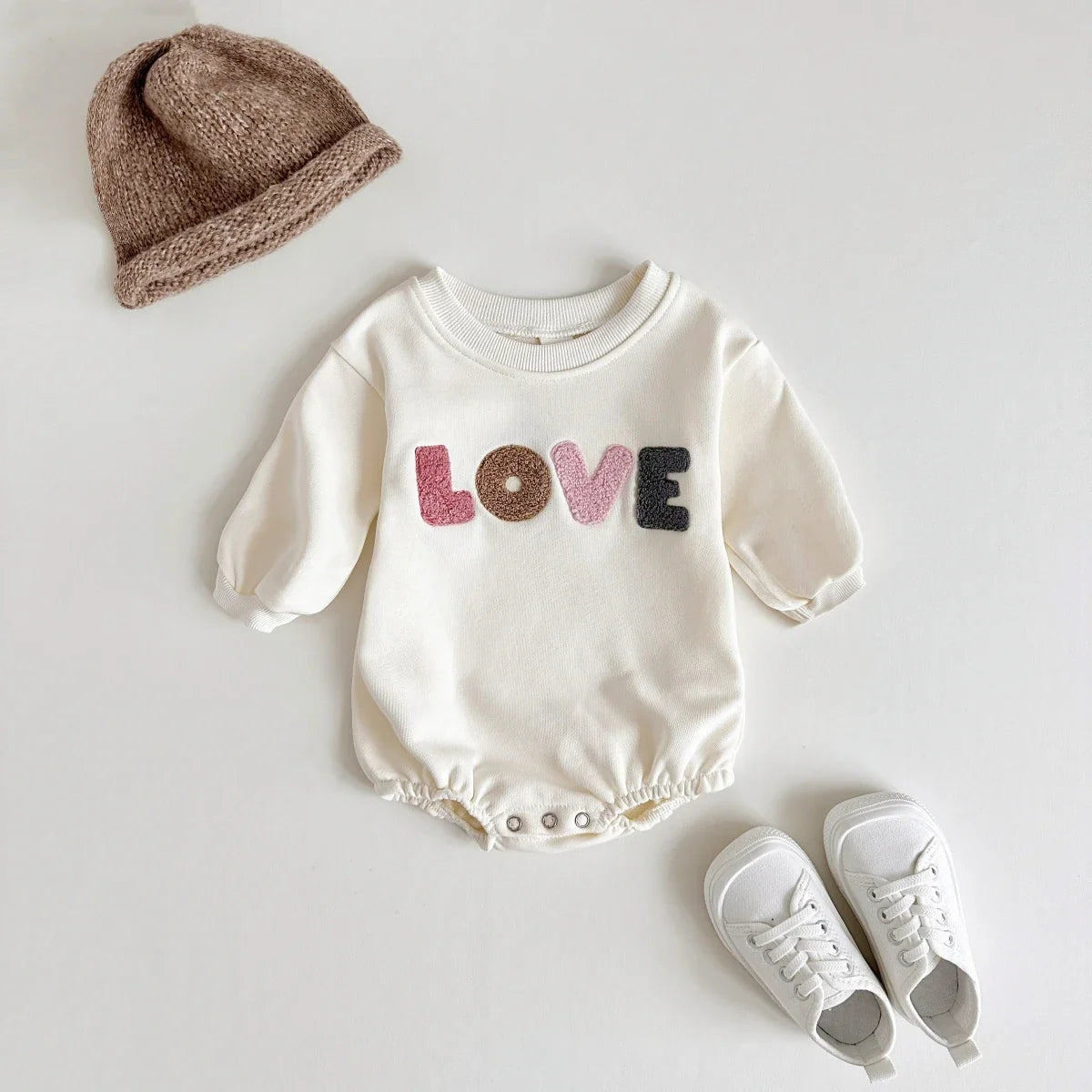 Toddler romper in khaki with charming 'love' embroidery, durable for everyday wear.