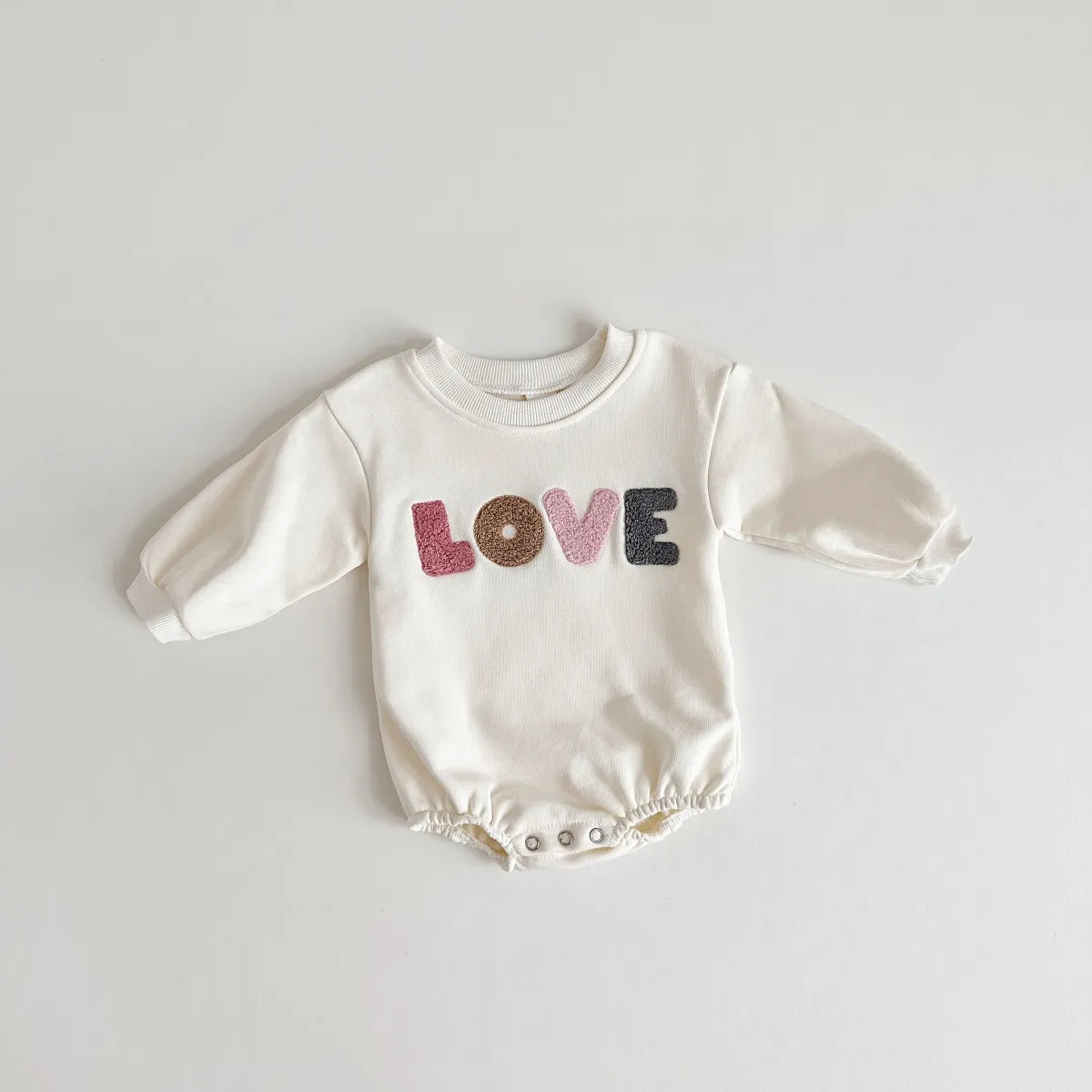 Khaki baby jumpsuit with 'love' embroidery, a versatile piece for infant and toddler wardrobes.