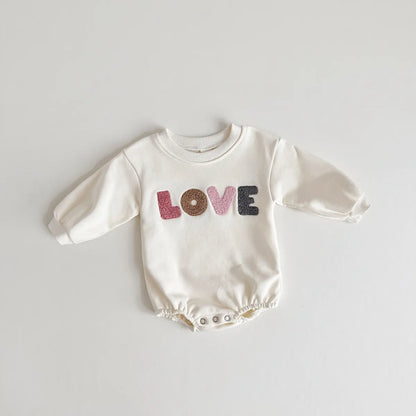Khaki baby jumpsuit with 'love' embroidery, a versatile piece for infant and toddler wardrobes.
