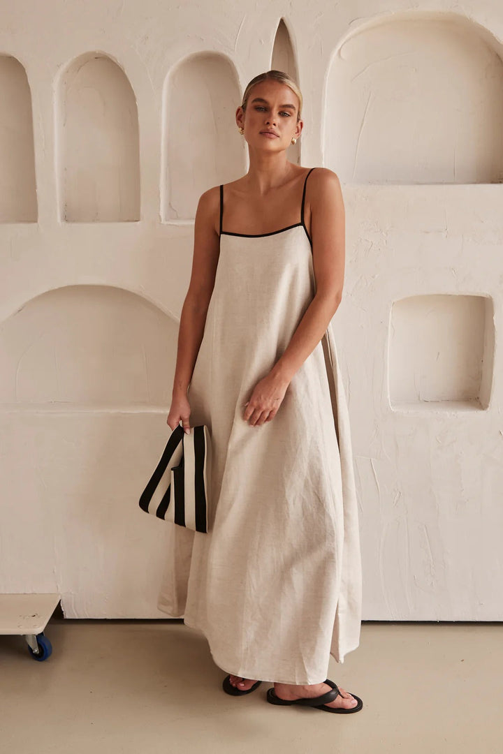 Cream oversized maxi dress for women, featuring a square neck, spaghetti straps, and elegant contrast trim.