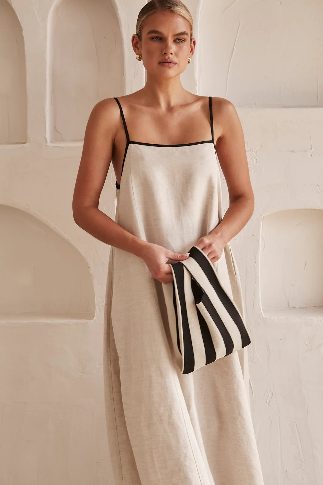 Elegant women's A-line cream maxi dress, contrast trim, square neck, spaghetti straps, and oversized fit.