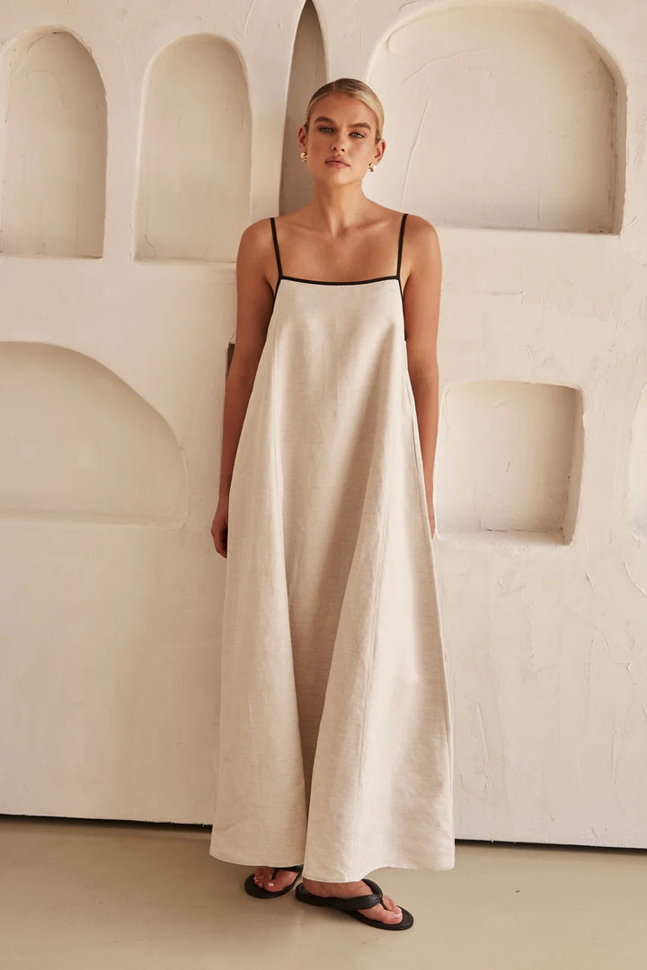 Resort wear cream maxi dress for women, square neck, spaghetti straps, flowy oversized fit, and contrast trim.