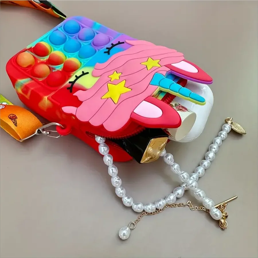 Close-up of a vibrant red silicone ladybug coin purse for kids