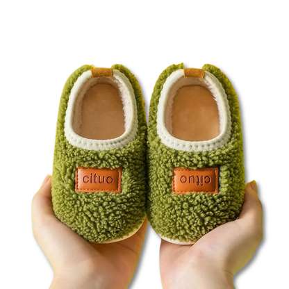 Close-up of anti-slip grip on soft sole infant walking shoes, ideal for first steps